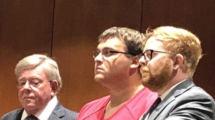 Parents questioned the Springboro school district’s handling of former first-grade gym teacher John Austin Hopkins, 25, of Springboro. He is pictued here during his arraignment, flanked by his father and son defense team, both named David A. Chicarelli.