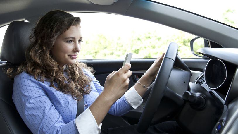 Distracted driving is both dangerous and common. (Dreamstime)