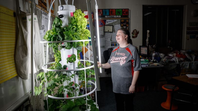 Westbrooke Village Elementary School STEM teacher Daniell Cossey stands next to the grow machine/tower in the classroom. Cossey is implementing agricultural education in her fifth grade classroom through the Green Bronx Machine program. JIM NOELKER/STAFF