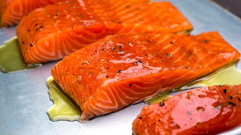 FILE-- Spiced, brown-sugar-cured salmon before being smoked, in July 2014. Healthful fats are not the only reason to eat fish, there are also lean protein, vitamins A and D as well as B vitamins, and a host of minerals to consider. (Andrew Scrivani/The New York Times)