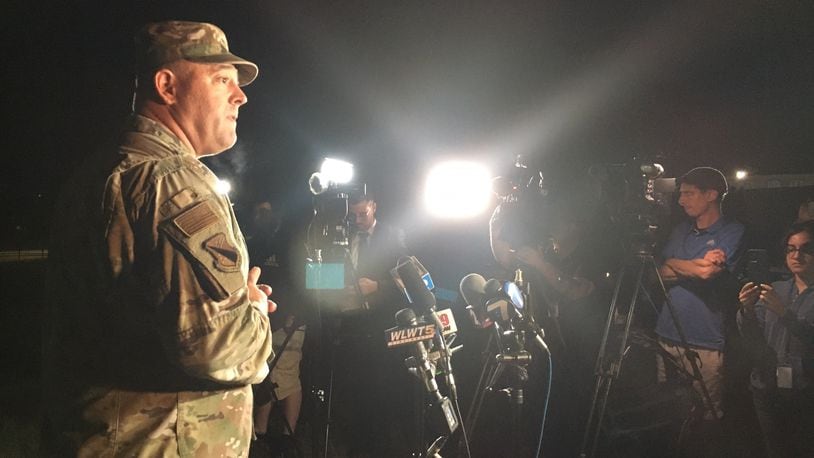 Col. Patrick MIller, commander of the 88th Air Base Wing at Wright-Patterson Air Force Base, addresses the media in a 2 a.m. press conference outside the Hope Hotel. A four-hour investigation found no active shooter on the base after an initial report. THOMAS GNAU/STAFF