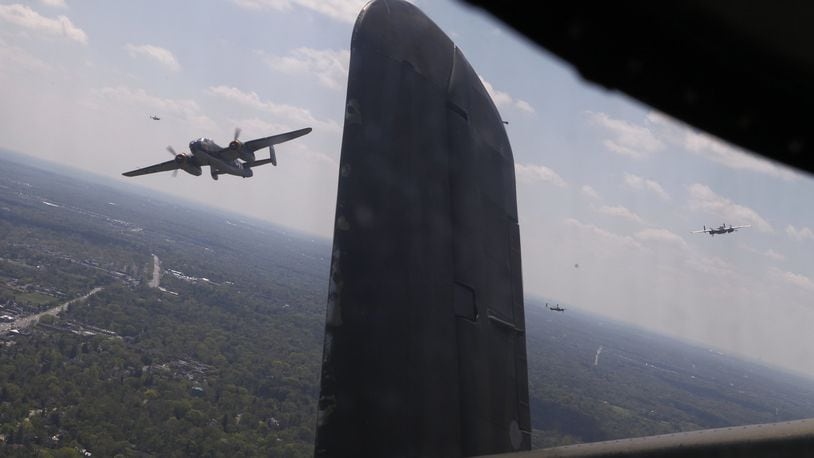 B-25s fly in formation over a National Museum of the U.S. Air Force memorial service Wednesday, April 18, 2012 on the 70th anniversary of the Doolittle Raid on Tokyo.