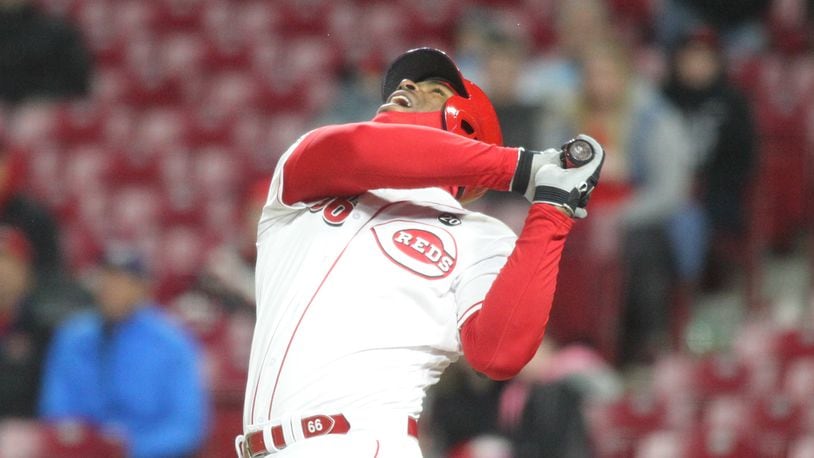 The Reds’ Yasiel Puig pops up for the final out of a loss to the Brewers on Monday, April 1, 2019, at Great American Ball Park in Cincinnati.