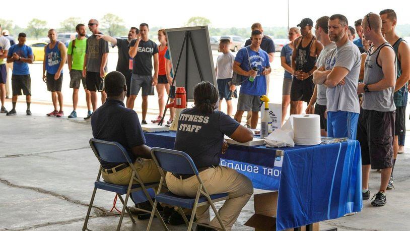 Members of Team Wright-Patt stand in line for registration at the Alpha Warrior Competition July 14. The event was free and open to individuals 18 years of age and older and working on Wright-Patterson Air Force Base. (U.S. Air Force photo/Wesley Farnsworth)