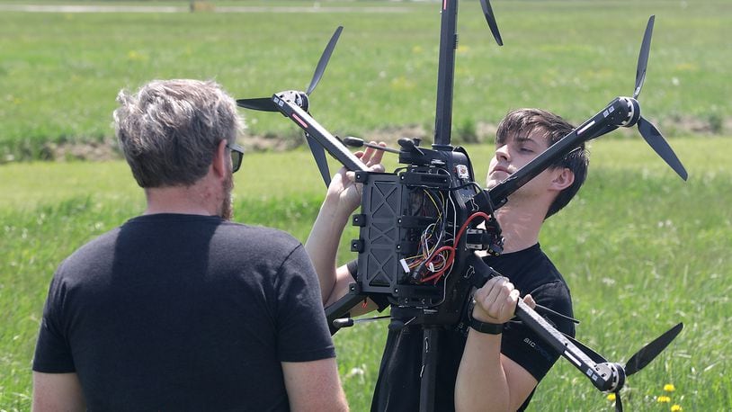Gus Meyer, a drone pilot at SIC Drones, calibrates one of the company's UAV's at the Springfield Beckley Municipal Airport Thursday, May 12, 2022. BILL LACKEY/STAFF