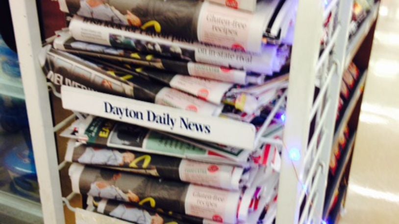 Early Thanksgiving Day editions of the Dayton Daily News are available now at locations including Dorothy Lane Market in Oakwood and Kroger on Wayne Avenue in Dayton. Staff photo by Barbara Kedziora.