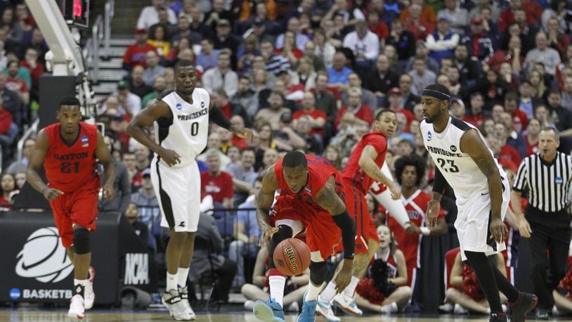 Dayton's Jordan Sibert picks up a loose ball and heads up the court in the first half against Providence in the second round of the NCAA tournament on Friday, March 20, 2015, at Nationwide Arena in Columbus. David Jablonski/Staff