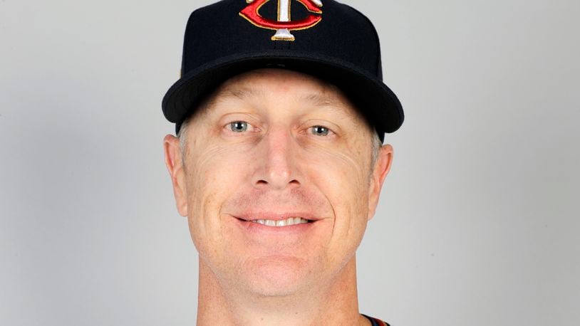 FILE - This is a 2020 file photo showing Mike Bell of the Minnesota Twins baseball team. Twins bench coach Mike Bell has taken an indefinite leave from the team because of kidney cancer. The 46-year-old Bell had surgery to remove the growth on Jan. 28, shortly after being diagnosed. He's been recovering at home with his family in Arizona. “He’s also very, very optimistic and also very encouraged and waiting for his return to the dugout," manager Rocco Baldelli said Wednesday, Feb. 17, 2021. (AP Photo/Brynn Anderson, File)