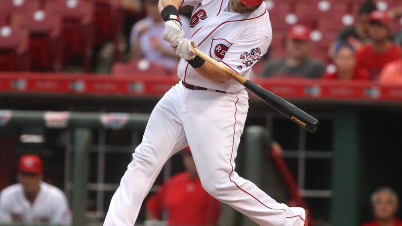 The Reds’ Tucker Barnhart hits a grand slam in the first inning against the Marlins on Tuesday, Aug. 16, 2016, at Great American Ball Park in Cincinnati. David Jablonski/Staff