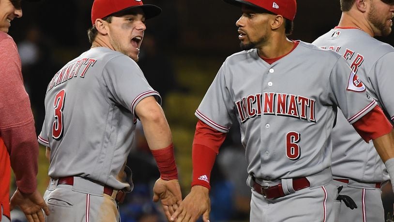 LOS ANGELES, CA - MAY 10: Billy Hamilton #6 is greeted by Scooter Gennett #3 of the Cincinnati Reds after defeating the Los Angeles Dodgers in the ninth inning at Dodger Stadium on May 10, 2018 in Los Angeles, California. (Photo by Jayne Kamin-Oncea/Getty Images)