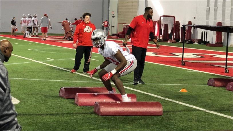 Freshman defensive end Zach Harrison takes part in a drill during the first day of Ohio State football’s spring practice Wednesday in Columbus. Marcus Hartman/STAFF