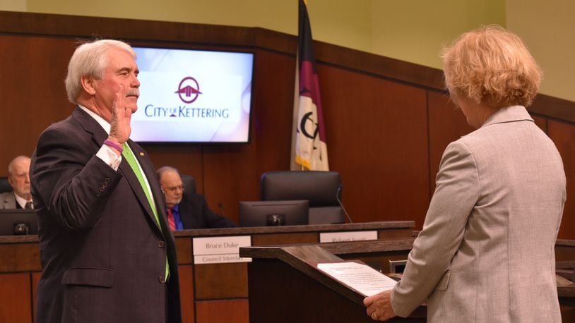 Maureen Patterson swears in Kettering Mayor Don Patterson for his final term in 2018. FILE PHOTO