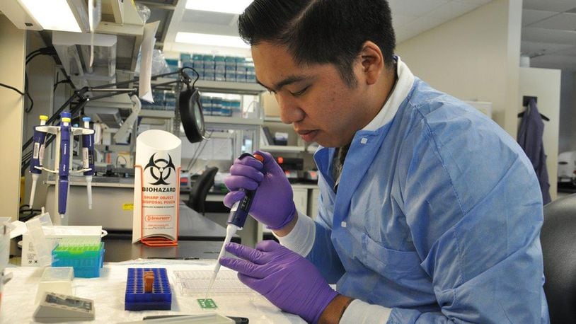 Staff Sgt. John Patrick Uy, medical laboratory technician, conducts a manual Q fever test screening for patients at the 711th Human Performance Wing’s United States Air Force School of Aerospace Medicine Public Health and Epidemiology Laboratory Aug. 16. (U.S. Air Force photo/Bryan Ripple)