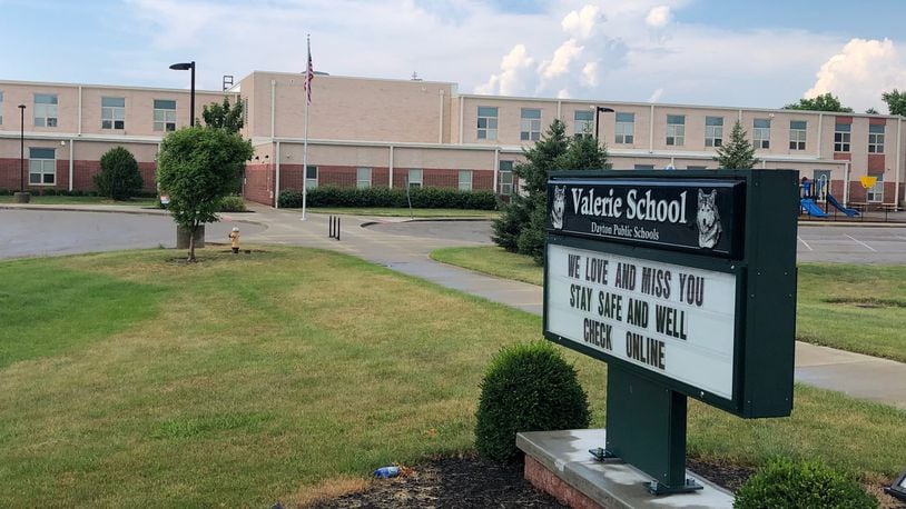 The sign outside Dayton's Valerie Elementary in July 2020 tells students that school staff love them and miss them.