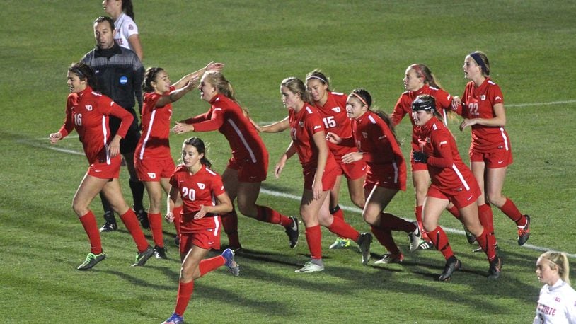 Dayton celebrates after taking a 2-1 lead on a goal by Libby Leedom in the second half against Ohio State in the first round of the NCAA tournament on Saturday, Nov. 12, 2016, at Jesse Owens Memorial Stadium in Columbus. David Jablonski/Staff