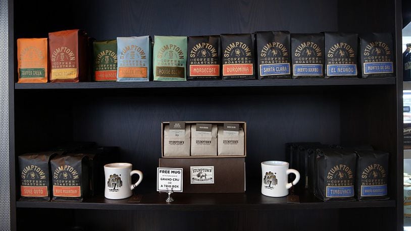 Coffee beans and cups on sale in a display inside Stumptown Coffee Roasters, which opened in December in the Ace Hotel in Chicago's West Loop across from Google headquarters.  (Nancy Stone/Chicago Tribune/TNS)