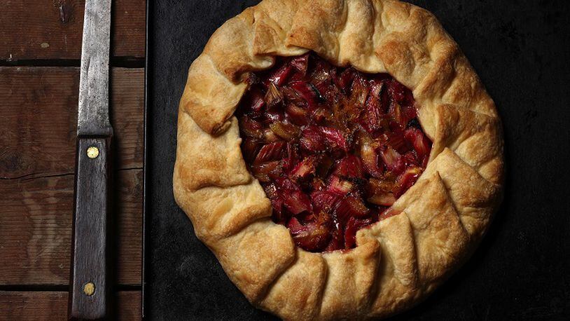 The tart filling is a simple combination of rhubarb, sugar and lemon, topped with dots of butter. The rustic tart is equally easy, requiring no fussy crimping or fitting into a pan. (styled by Joan Moravek) (E. Jason Wambsgans/Chicago Tribune/TNS)