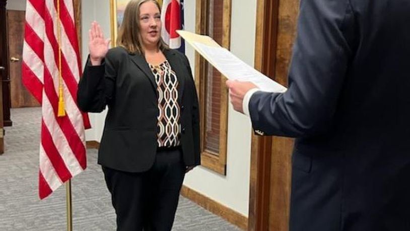 Ashley Caldwell is sworn in as Greene County assistant proscutor by county prosecutor David Hayes. CONTRIBUTED