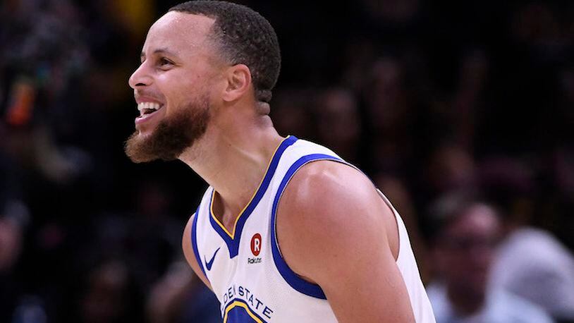 The Golden State Warriors' Stephen Curry reacts after making a 3-point basket against the Cleveland Cavaliers during the final minute of fourth quarter of Game 3 of the NBA Finals at Quicken Loans Arena in Cleveland, Ohio, on Wednesday, June 6, 2018. (Jose Carlos Fajardo/Bay Area News Group/TNS)