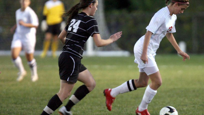 Fairfield’s Macy Hamblin (right) dribbles past Lakota East’s Sarah Benz (24) during a Division I tournament game Oct. 19, 2010, at Fairfield. GREG LYNCH/STAFF