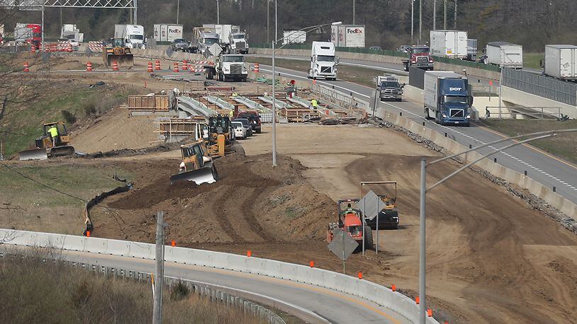 Construction continues on the Interstate 70 overpass over US 68 Tuesday. The overpass is part of ODOT's I-70 lane addition project. BILL LACKEY/STAFF