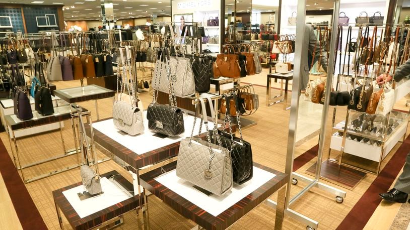 Business: Retailer Michael Kors to close 100+