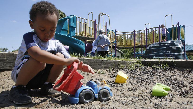 Aeshan Evans plays in the sandbox at Shullgate Park in Huber Heights on one of the nicest days in May when the sun was shining and temperatures reached into the 70’s. TY GREENLEES / STAFF