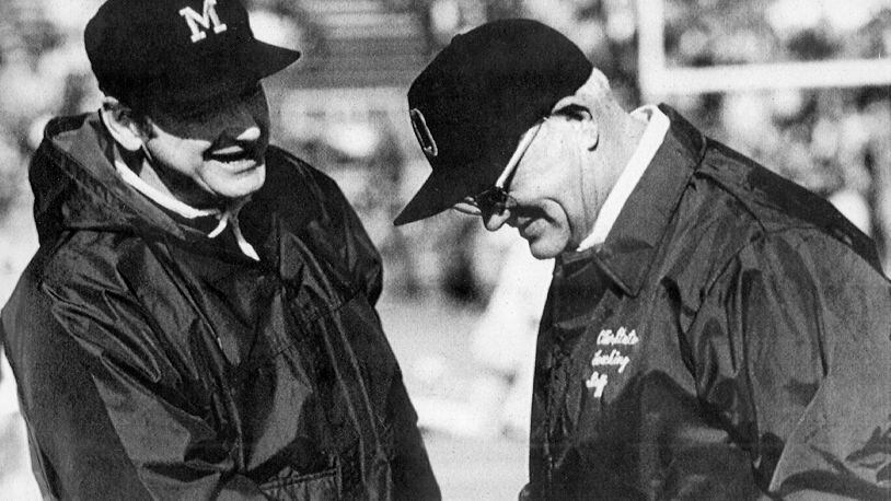 FILE - Michigan football coach Bo Schembechler, left, meets with Ohio State coach Woody Hayes in this file photo, location unknown. No. 2 Ohio State and No. 3 Michigan have a chance to add to The Game lore. If highly anticipated matchup goes as expected on Saturday in the Horseshoe, it will join the long lore of memorable games in a series that dates to 1897. (AP Photo, File)