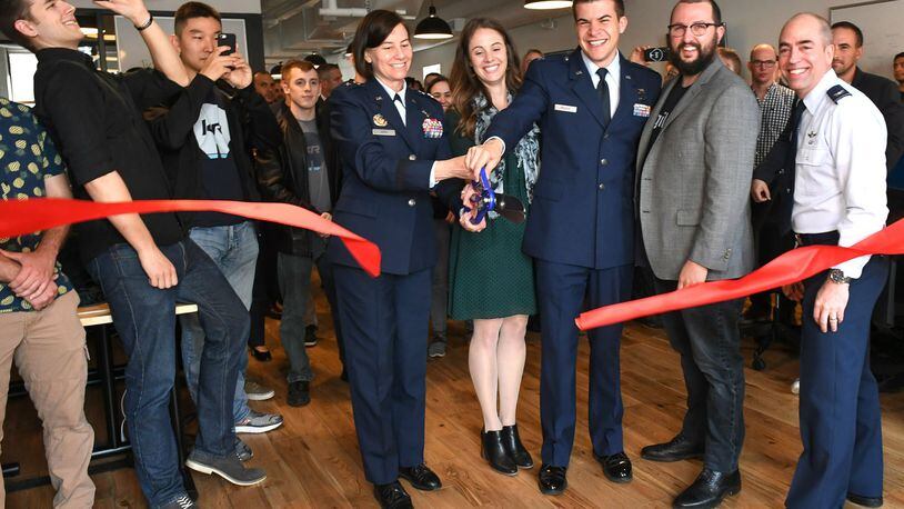 Maj. Gen. Sarah Zabel, the Air Force s director of Information Technology Acquisition Process Development at the Pentagon, cuts the ribbon for the Kessel Run Experimentation Lab opening in Boston May 7, 2018, with Victoria Galvin, KREL s chief business officer, Capt. Bryon Kroger, KREL s chief operating officer and Adam Furtado, KREL s chief product officer. Col. Don Hill, right, represented the Air Force Life Cycle Management Center s Battle Management Directorate, which oversees sustainment and upgrade of Air Operations Centers throughout the world. The KREL space will house teams of Airmen tasked to create software specifically for use in AOCs. (U.S. Air Force photo/Todd Maki)