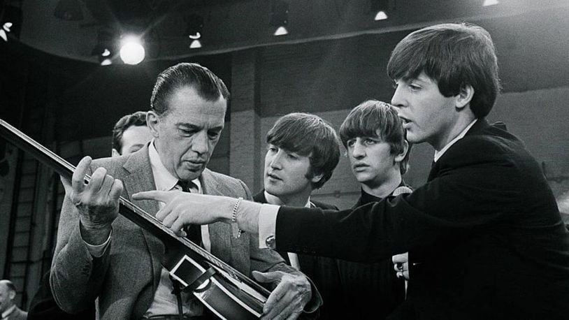 Paul McCartney shows Ed Sullivan the finer points of the bass guitar during The Beatles' rehearsal for their first U.S. television show 55 years ago.