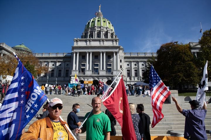 Supporters of President Donald Trump rally outside the Pennsylvania State Capitol in Harrisburg, Pa., on Saturday, Nov. 7, 2020, after it was announced that Joe Biden was elected the 46th president of the United States. President-elect Biden achieved victory offering a message of healing and unity. He will return to Washington facing a daunting set of crises. (Victor J. Blue/The New York Times)