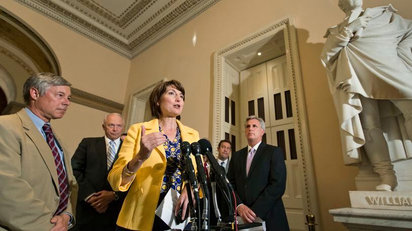 FILE - In this July 17, 2013, file photo Rep. Cathy McMorris Rodgers, R-Wash., center, chair of the House Republican Caucus, and other GOP leaders, meet with reporters just before a vote to delay the individual and employer mandates of President Barack Obama's signature health care law at the Capitol in Washington. At far left is Rep. Fred Upton, R-Mich., chairman of the Committee on Energy and Commerce, second from left at rear is Rep. John Kline, R-Minn., Chairman of the House Education Committee, and at right is House Majority Whip Kevin McCarthy, R-Calif. (AP Photo/J. Scott Applewhite, File)