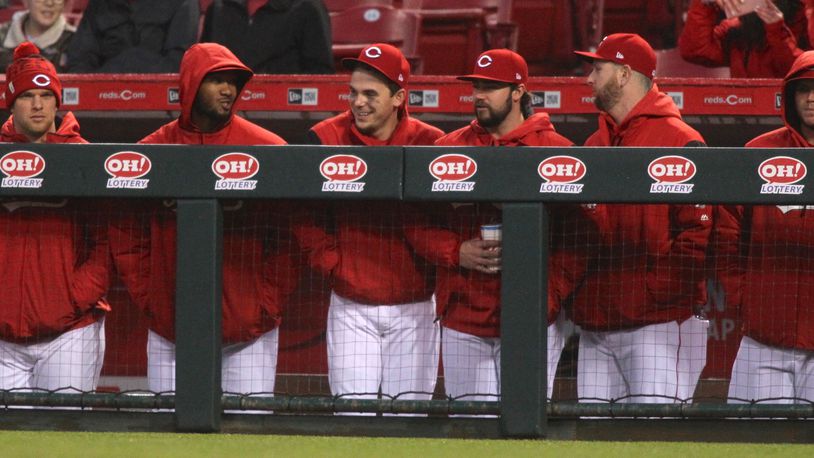 Reds players, including Amir Garrett, second from left, watch a game against the Giants on Friday, May 5, 2017, at Great American Ball Park in Cincinnati.