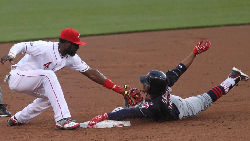 Reds second baseman Brandon Phillips tags out the Indians’ Francisco Lindor, who was trying to stretch a single into a double, on Wednesday, May 18, 2016, at Great American Ball Park in Cincinnati. David Jablonski/Staff