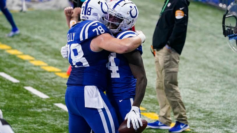 Indianapolis Colts wide receiver Zach Pascal (14) celebrates a touchdown with center Ryan Kelly (78) in the second half of an NFL football game against the Houston Texans in Indianapolis, Sunday, Dec. 20, 2020. (AP Photo/Darron Cummings)