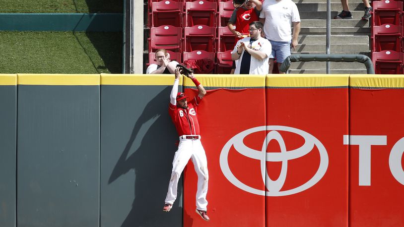 CINCINNATI, OH - JUNE 10: Billy Hamilton #6 of the Cincinnati Reds makes a catch against the center field wall to take a hit away from Matt Carpenter of the St. Louis Cardinals in the ninth inning at Great American Ball Park on June 10, 2018 in Cincinnati, Ohio. The Reds won 6-3. (Photo by Joe Robbins/Getty Images)