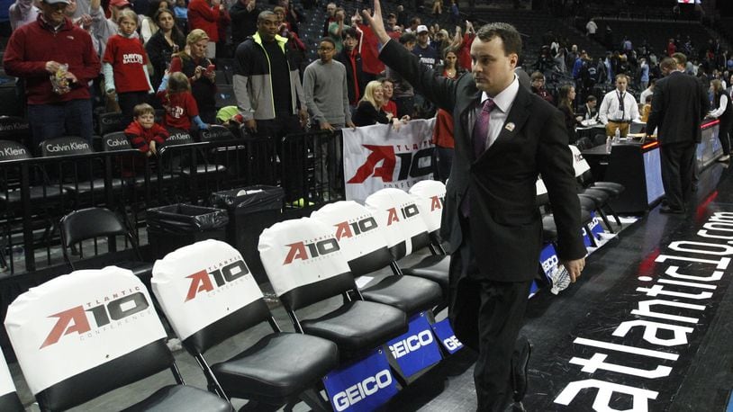 Dayton coach Archie Miller waves to the fans as he leaves the court after a victory against Rhode Island in the semifinals of the Atlantic 10 tournament on Saturday, March 14, 2015, at the Barclays Center in Brooklyn, N.Y. David Jablonski/Staff