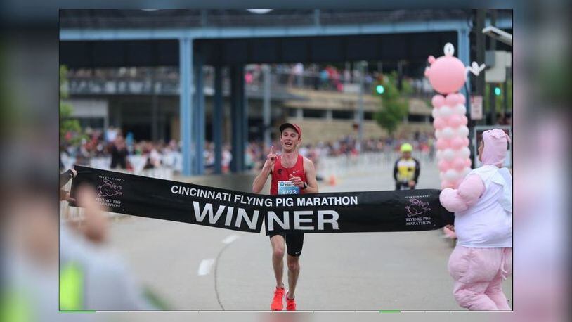 Oakwood High School graduate Jack Randall crosses the finish line to win the 2019 Flying Pig Marathon on Sunday in Cincinnati. It was his second Flying Pig win in three years. (Contributed)