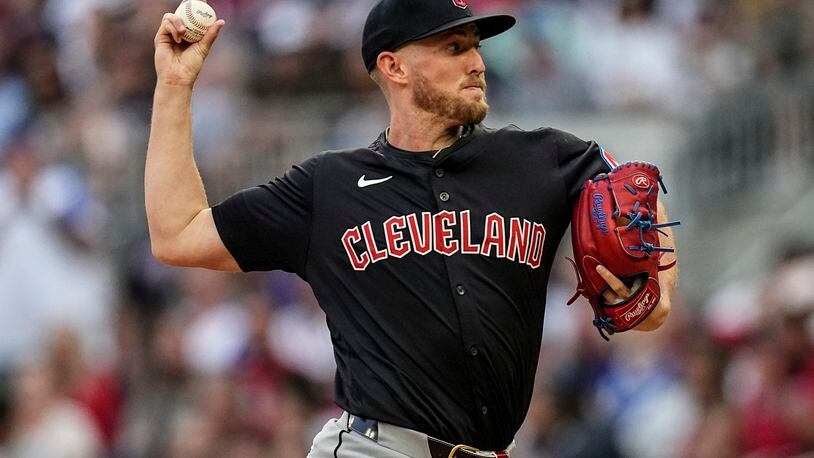 Cleveland Guardians pitcher Tanner Bibee (28) delivers in the first inning of a baseball game against the Atlanta Braves, Saturday, April 27, 2024, in Atlanta. (AP Photo/Mike Stewart)