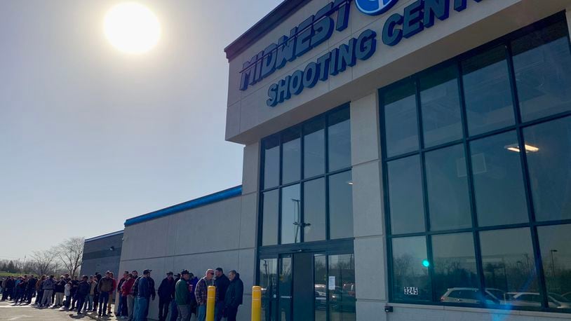 Shooting sports enthusiasts were lined up outside Midwest Shooting Center in Beavercreek for its opening Saturday morning. LONDON BISHOP/STAFF