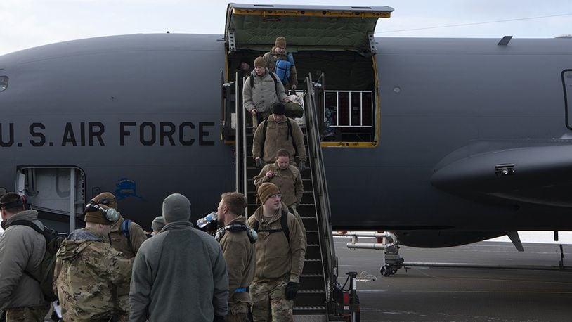 Recently arrived Airmen from the 168th Wing, Alaska Air National Guard, Eielson Air Force Base, Alaska, carry luggage off a KC-135R Stratotanker at Ørland Air Station, Norway, March 5.