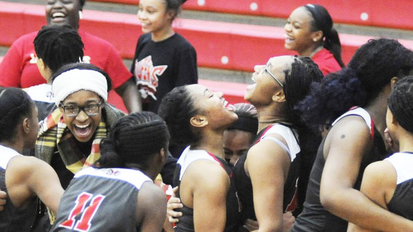 Trotwood-Madison players celebrate after a 37-35 girls high school basketball win at Tippecanoe on Thursday, Jan. 24, 2019. MARC PENDLETON / STAFF