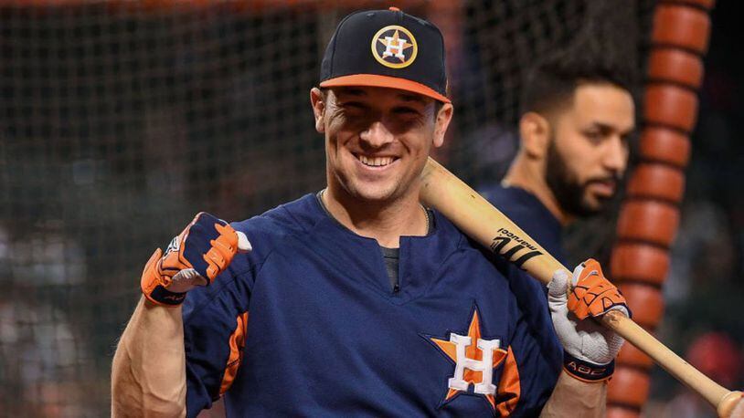 Houston Astros third baseman Alex Bregman pitched in to help distribute food to needy families.