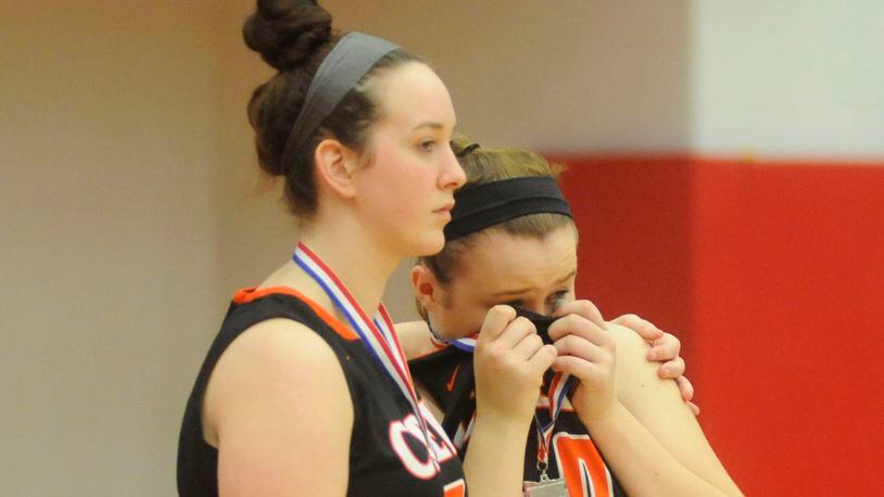 Haley Hutchins (left) and Michaela Rhoades take a hard loss to Mason in a D-I district final at Princeton on Sat., Marcy 3, 2018. MARC PENDLETON / STAFF