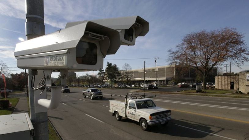 Dayton will restart its traffic camera program under new rules.