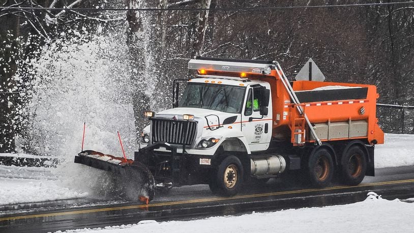 A snow plow from the Butler County Engineer’s Office blasts snow into the air on Elk Creek Road Wednesday, Feb. 20 in Madison Township. NICK GRAHAM/STAFF