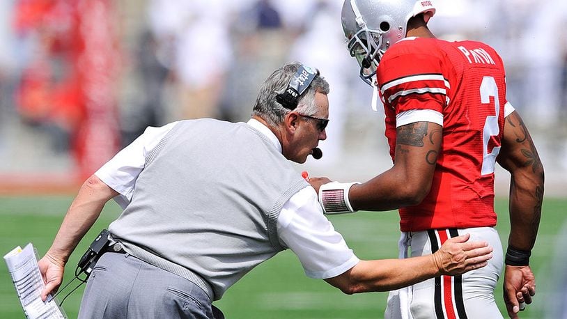 COLUMBUS, OH - SEPTEMBER 05:  Head coach Jim Tressel of the Ohio State Buckeyes congratulates his quarterback Terrelle Pryor #2 after the Buckeyes added another touchdown against the Navy Midshipmen at Ohio Stadium on September 5, 2009 in Columbus, Ohio. Ohio State defeated Navy 31-27. (Photo by Jamie Sabau/Getty Images)