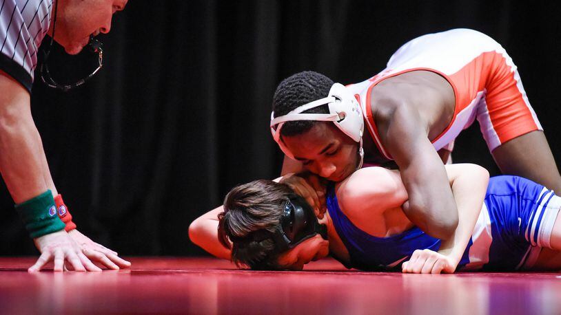 Fairfield’s Moustapha Bah got a pin to win the match in the 106-pound weight class against Springboro’s Michael Gust on Jan. 19 at Fairfield’s Performing Arts Center. NICK GRAHAM/STAFF