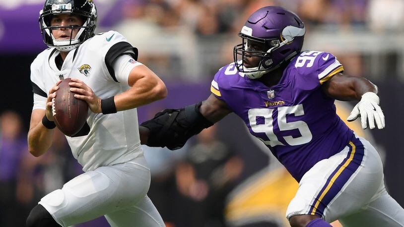 MINNEAPOLIS, MN - AUGUST 18: Ifeadi Odenigbo #95 of the Minnesota Vikings gives chase to Cody Kessler #6 of the Jacksonville Jaguars during the fourth quarter in the preseason game on August 18, 2018 at US Bank Stadium in Minneapolis, Minnesota. Odenigbo got a sack on the play. The Jaguars defeated the Vikings 14-10. (Photo by Hannah Foslien/Getty Images)