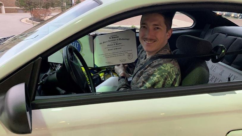 Second Lt. Nathan Barker was presented his diploma at an Air Force Insitute of Technology ‘drive thru’ as part of his out processing. Due to current concerns of COVID-19, a commencement ceremony for 2020 graduates was not held. About 60 diplomas were presented to students at the out-processing ‘drive thru.’ AFIT’s Graduate School of Engineering and Management awarded 236 master’s degrees and seven doctorate degrees in science, technology, engineering and math fields. Two graduate student’s received dual master’s degrees. (Courtesy photo)